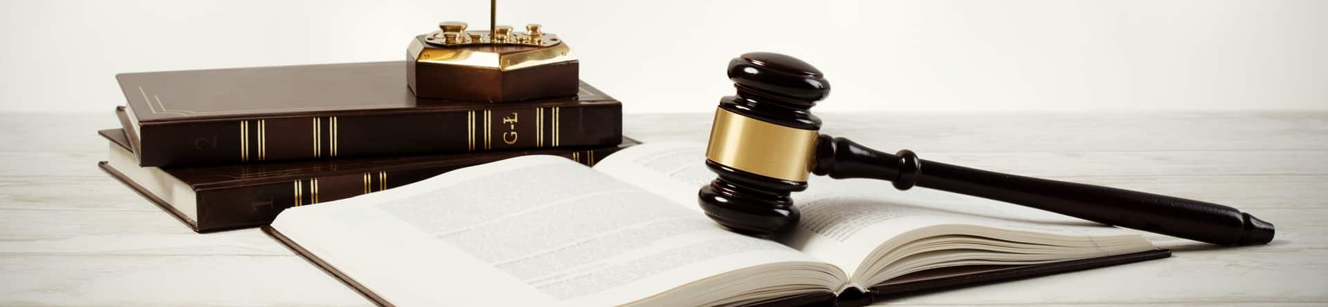 Gavel Sitting On Open Law Textbook